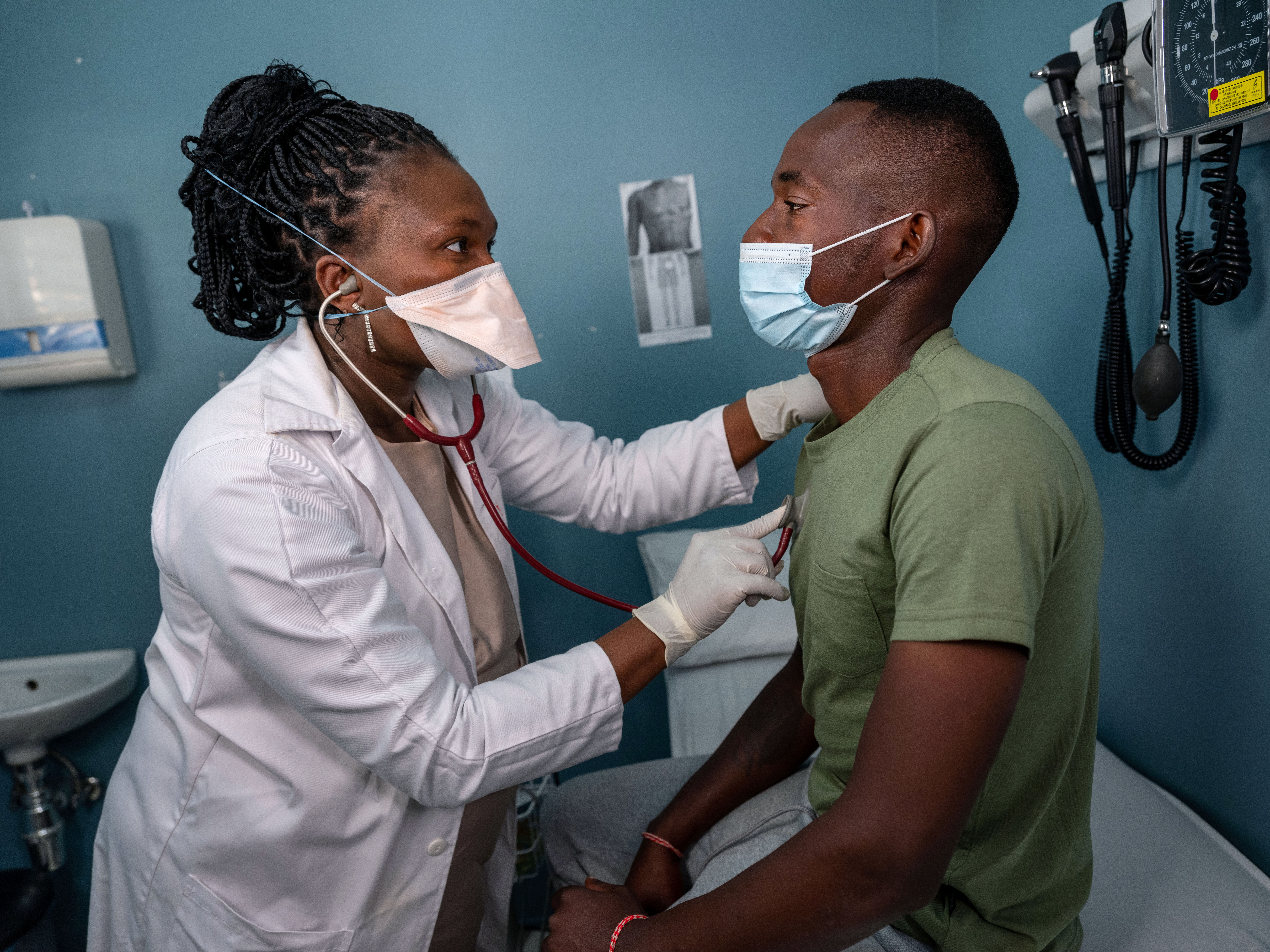 Doctor examines a TB patient 
